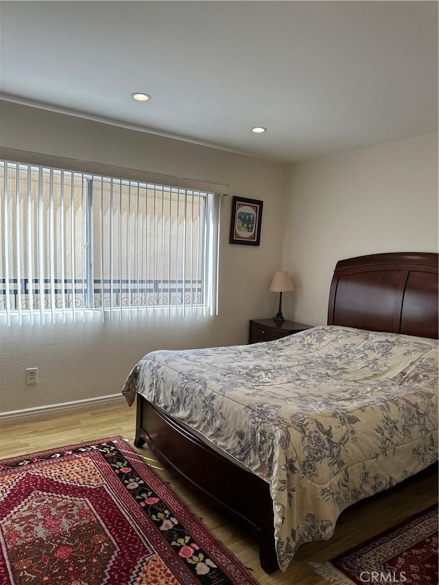 1236 N Columbus Ave Unit 41, Glendale, CA 91202 - bedroom with wood finished floors, baseboards, and recessed lighting