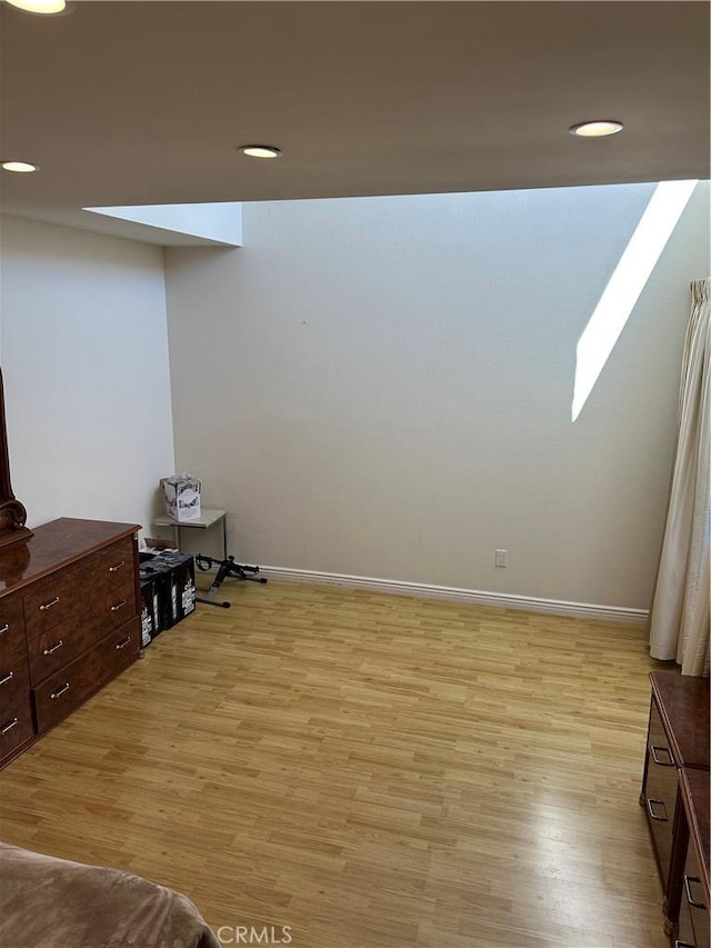 1236 N Columbus Ave Unit 41, Glendale, CA 91202 - unfurnished bedroom featuring light wood-style flooring, baseboards, and recessed lighting