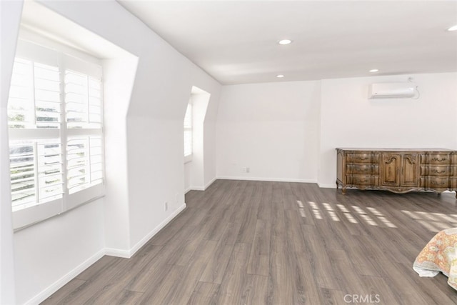 449 Fern Dell Pl, Glendora, CA 91741 - empty room with a wall unit AC, wood finished floors, recessed lighting, and baseboards