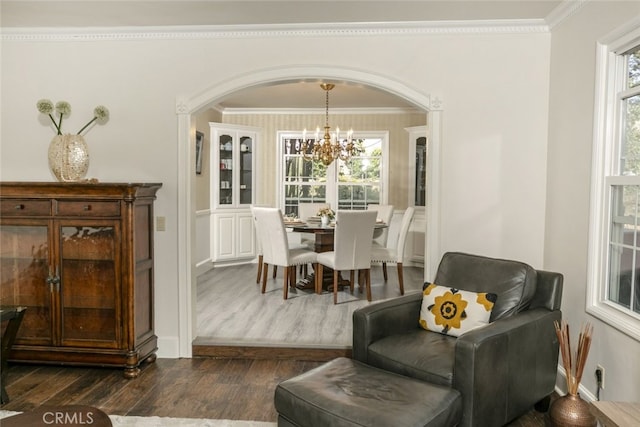 449 Fern Dell Pl, Glendora, CA 91741 - dining room with a chandelier, ornamental molding, dark wood-style floors, arched walkways, and plenty of natural light