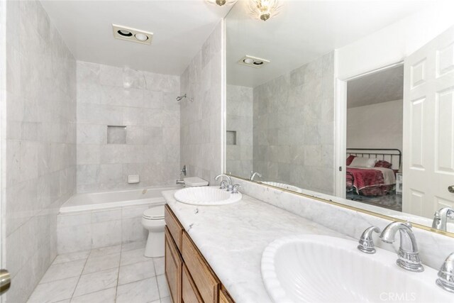 449 Fern Dell Pl, Glendora, CA 91741 - bathroom featuring tile patterned floors, ensuite bath, tiled shower / bath, double vanity, and toilet