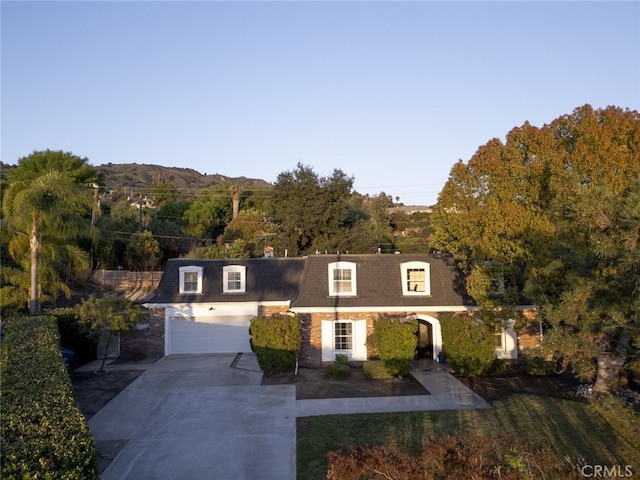 449 Fern Dell Pl, Glendora, CA 91741 - view of front of home featuring concrete driveway, roof with shingles, mansard roof, and a front lawn
