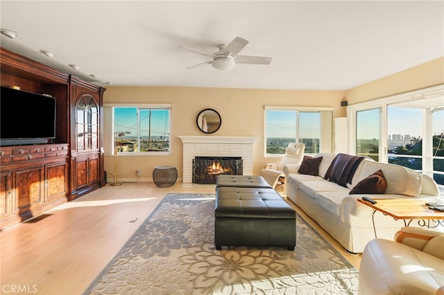 8017 Floral Ave, Los Angeles, CA 90046 - living room with wood finished floors, a ceiling fan, baseboards, visible vents, and a fireplace