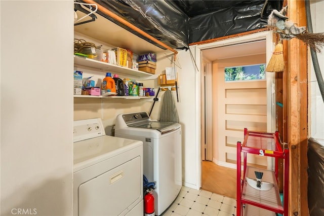 8017 Floral Ave, Los Angeles, CA 90046 - laundry area with light floors, laundry area, and washer and clothes dryer