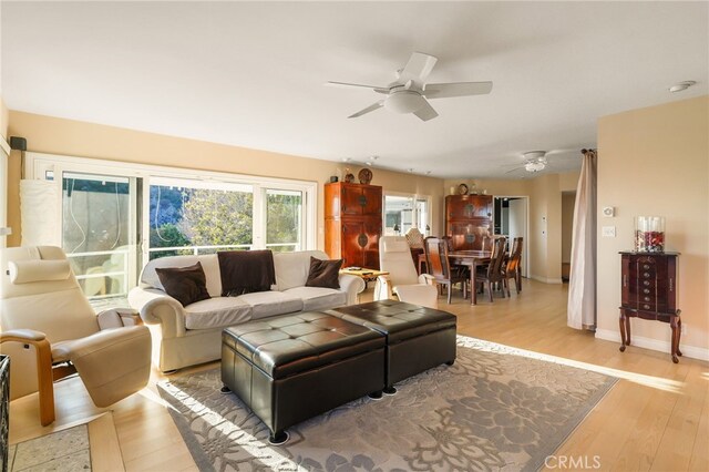 8017 Floral Ave, Los Angeles, CA 90046 - living area with baseboards, ceiling fan, and wood finished floors