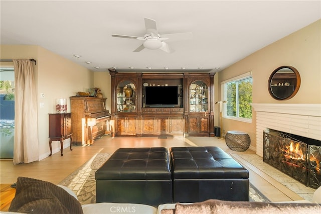 8017 Floral Ave, Los Angeles, CA 90046 - living room with baseboards, a brick fireplace, wood finished floors, and a ceiling fan