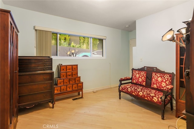 8017 Floral Ave, Los Angeles, CA 90046 - sitting room featuring light wood finished floors, visible vents, and baseboards