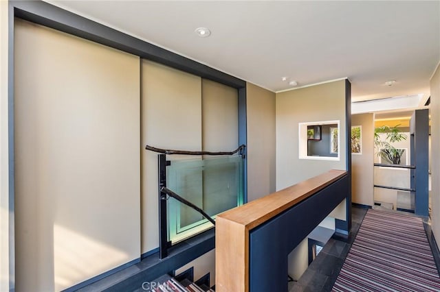 hall featuring recessed lighting