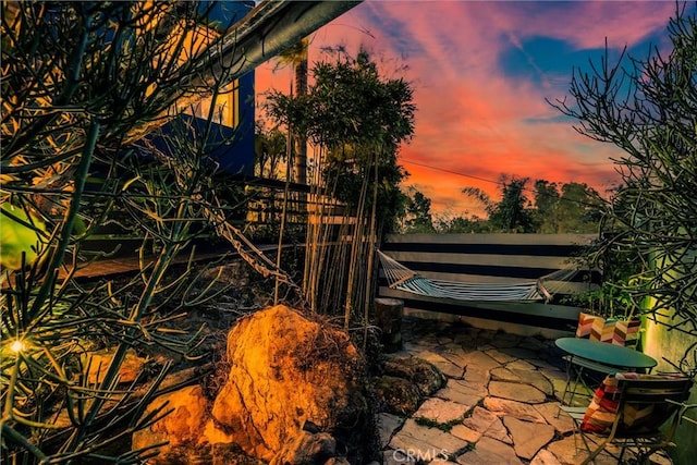 view of patio terrace at dusk