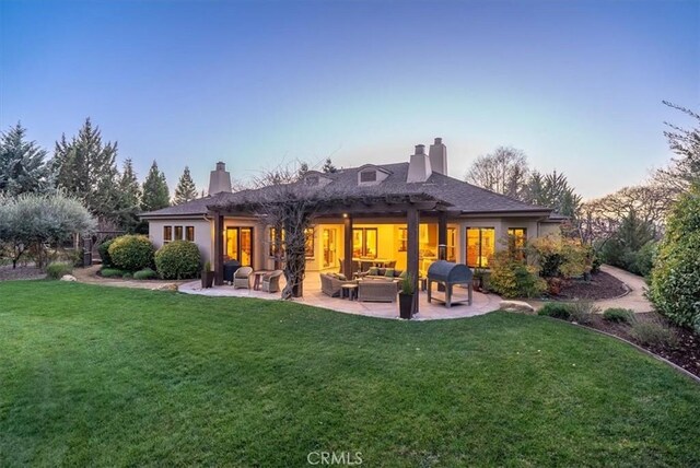 1065 Burnt Rock Way, Templeton, CA 93465 - rear view of house with outdoor lounge area, a lawn, a patio, and a chimney