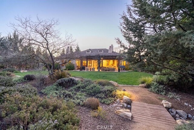1065 Burnt Rock Way, Templeton, CA 93465 - back of property with a chimney, a yard, and a patio