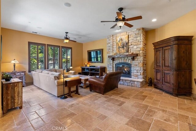 1065 Burnt Rock Way, Templeton, CA 93465 - living room with recessed lighting, stone tile floors, visible vents, a fireplace, and ceiling fan