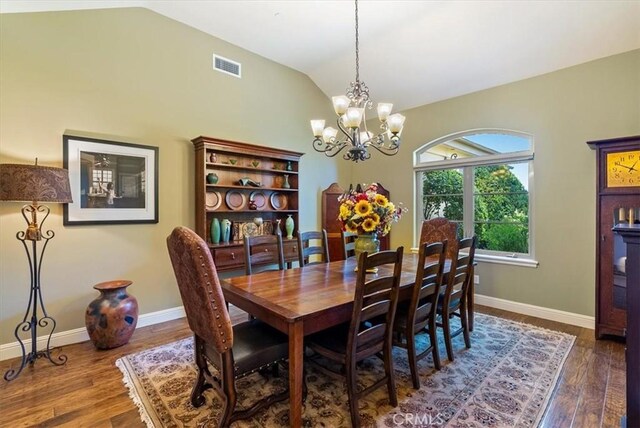 1065 Burnt Rock Way, Templeton, CA 93465 - dining area with dark wood-style flooring, vaulted ceiling, baseboards, visible vents, and a chandelier