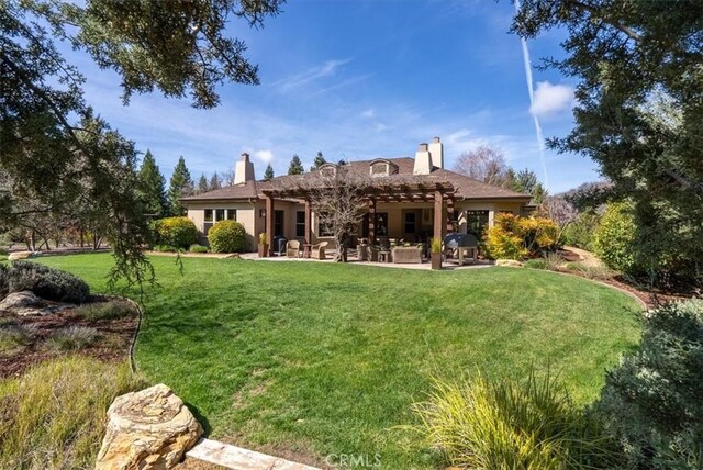 1065 Burnt Rock Way, Templeton, CA 93465 - rear view of property with a pergola, a chimney, a yard, and a patio