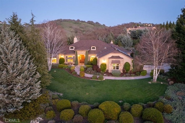 1065 Burnt Rock Way, Templeton, CA 93465 - view of front of house with a chimney, a front yard, and a mountain view