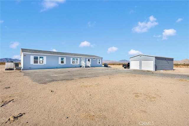 36090 Old Woman Springs Rd, Lucerne Valley, CA 92356 - single story home with an outbuilding, a mountain view, and a garage