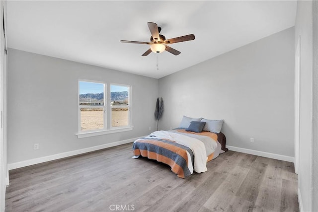 36090 Old Woman Springs Rd, Lucerne Valley, CA 92356 - bedroom with ceiling fan, baseboards, and wood finished floors