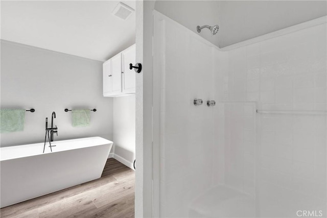 36090 Old Woman Springs Rd, Lucerne Valley, CA 92356 - bathroom with visible vents, wood finished floors, baseboards, a freestanding bath, and walk in shower