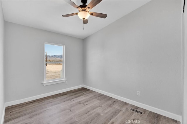 36090 Old Woman Springs Rd, Lucerne Valley, CA 92356 - spare room featuring light wood-type flooring, visible vents, baseboards, and a ceiling fan