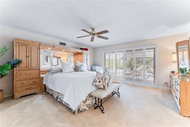 bedroom with access to outside, light carpet, a textured ceiling, a ceiling fan, and baseboards