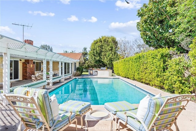 swimming pool featuring a pergola