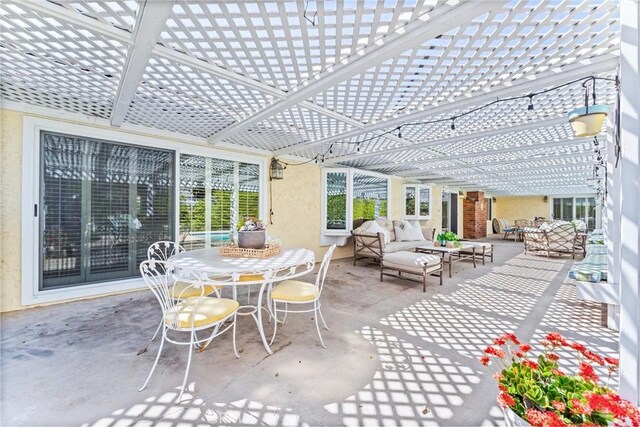 view of patio / terrace with a pergola, outdoor dining area, and an outdoor living space