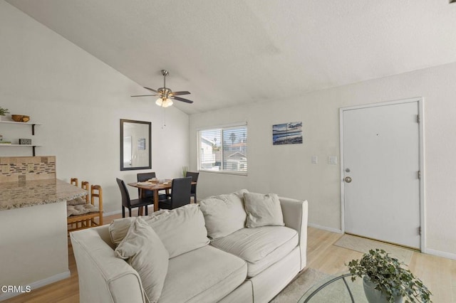 5125 W Wooley Rd Unit 5, Oxnard, CA 93035 - living room with a ceiling fan, light wood finished floors, and vaulted ceiling