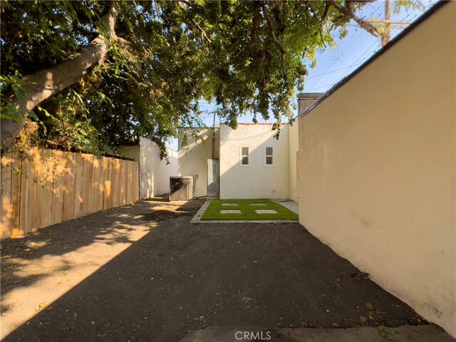 view of yard with a patio and fence