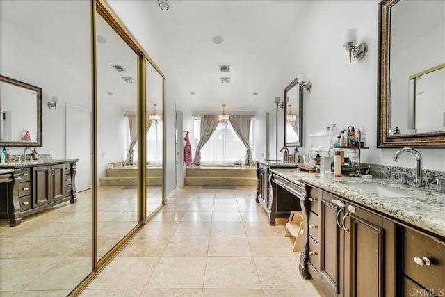 5274 Margaret, Bonita, CA 91902 - full bathroom with two vanities, tile patterned flooring, a sink, and a garden tub
