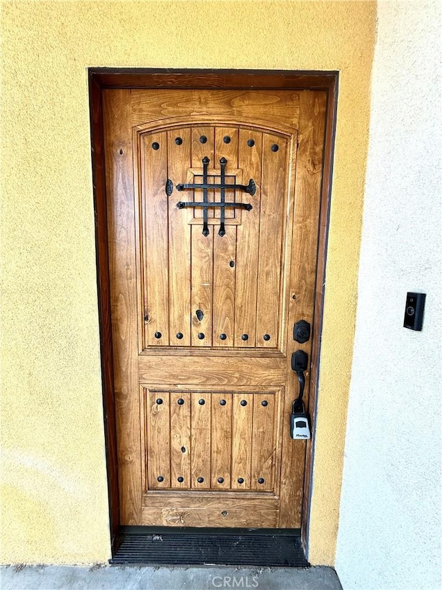645 E 78th St, Los Angeles, CA 90001 - doorway to property featuring stucco siding