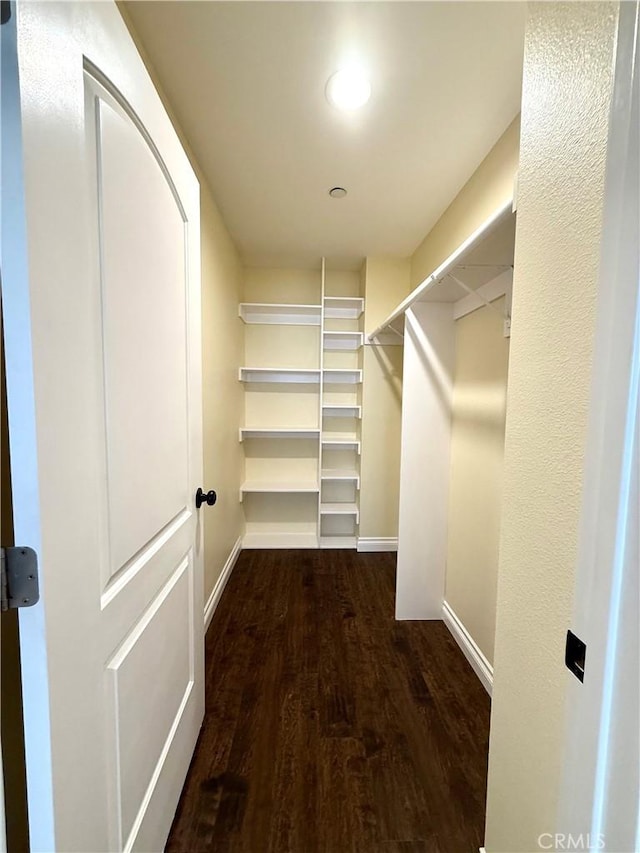 645 E 78th St, Los Angeles, CA 90001 - spacious closet featuring dark wood finished floors
