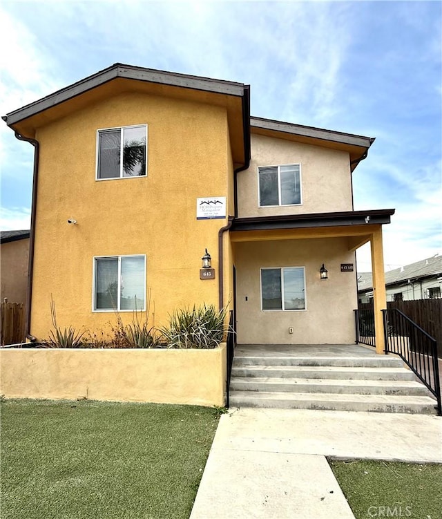 645 E 78th St, Los Angeles, CA 90001 - view of front of house with stucco siding and covered porch