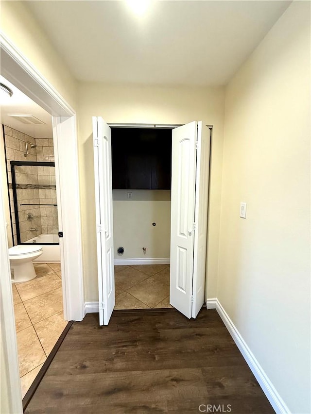 645 E 78th St, Los Angeles, CA 90001 - corridor with wood finished floors and baseboards