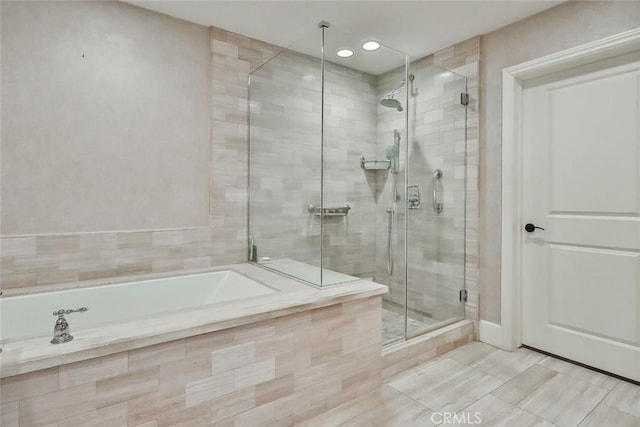 full bathroom featuring a bath, recessed lighting, tile patterned floors, and a stall shower