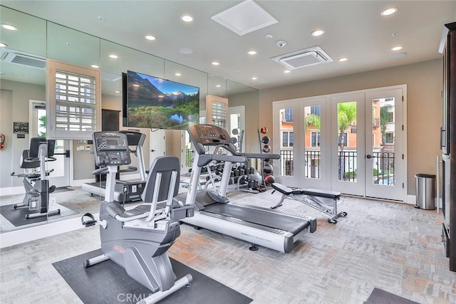 gym with baseboards, recessed lighting, and a healthy amount of sunlight