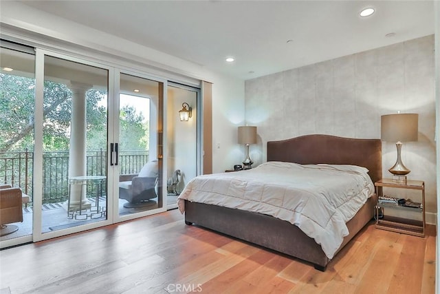 23500 Park Sorrento Unit D34, Calabasas, CA 91302 - bedroom with access to exterior, wood finished floors, and recessed lighting