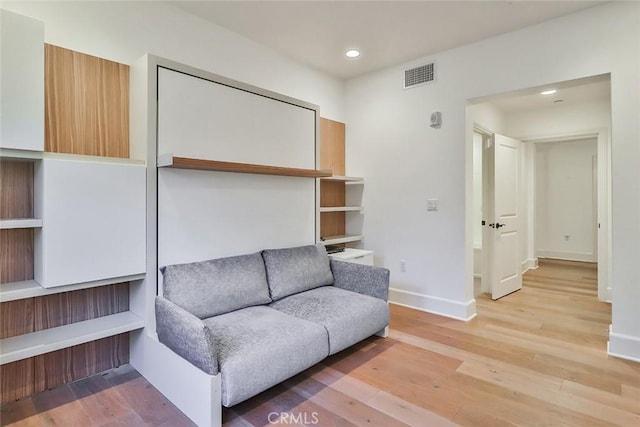 sitting room with recessed lighting, wood finished floors, visible vents, and baseboards