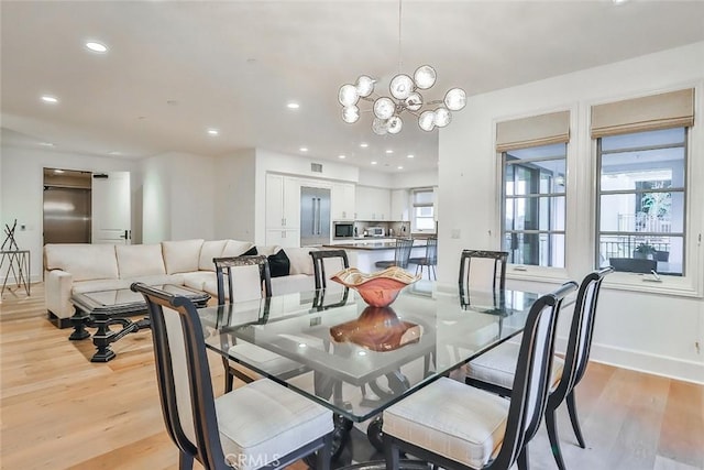 dining space featuring recessed lighting, visible vents, light wood-type flooring, baseboards, and a chandelier