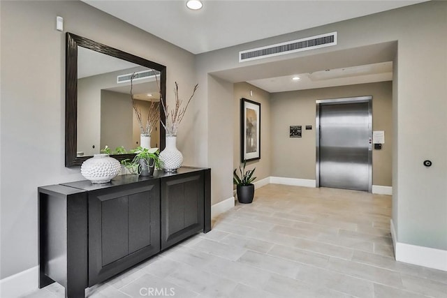 23500 Park Sorrento Unit D34, Calabasas, CA 91302 - hall featuring elevator, baseboards, and recessed lighting