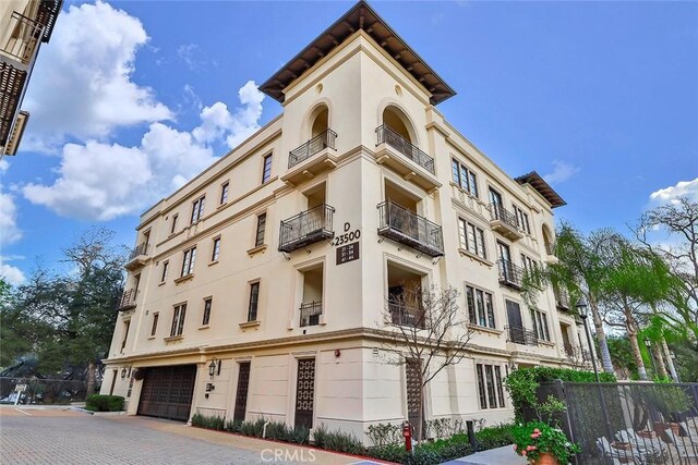 23500 Park Sorrento Unit D34, Calabasas, CA 91302 - view of apartment building / complex with fence and an attached garage