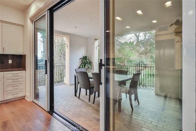 doorway with a wealth of natural light, visible vents, and recessed lighting