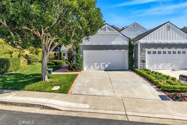 33972 Cape Cv, Dana Point, CA 92629 - view of front of home with an attached garage, concrete driveway, and a front lawn