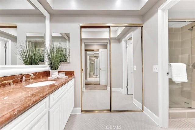 33972 Cape Cv, Dana Point, CA 92629 - full bathroom with baseboards, vanity, and a shower stall