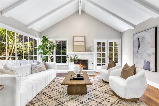 33972 Cape Cv, Dana Point, CA 92629 - living room with wood finished floors, baseboards, high vaulted ceiling, beam ceiling, and a fireplace
