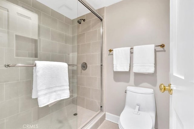 33972 Cape Cv, Dana Point, CA 92629 - bathroom featuring baseboards, toilet, and a stall shower