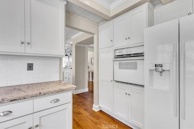 33972 Cape Cv, Dana Point, CA 92629 - kitchen featuring tasteful backsplash, white cabinets, white appliances, and crown molding