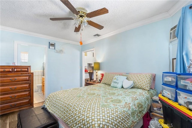 bedroom featuring visible vents, a textured ceiling, and crown molding