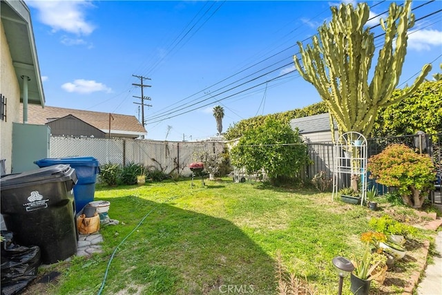 view of yard with a fenced backyard