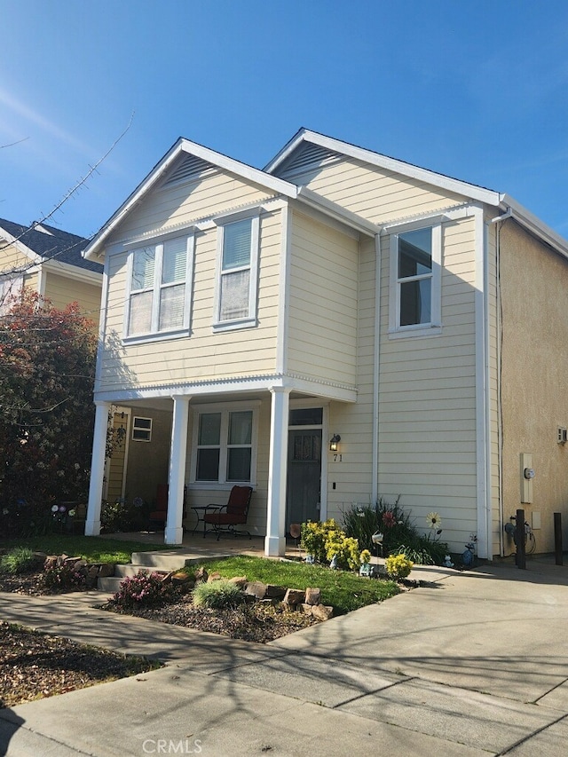 traditional-style home with covered porch