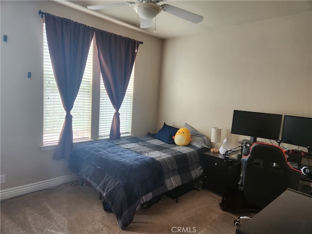 bedroom featuring carpet flooring, baseboards, and ceiling fan